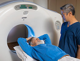 man going into CAT scn