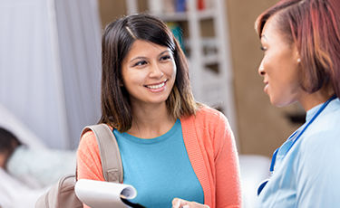 image of woman talking to doctor