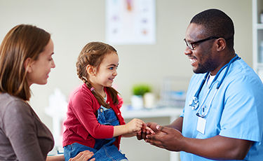 image of doctor with mother and child