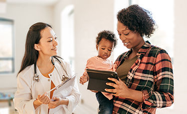 happy woman with a doctor